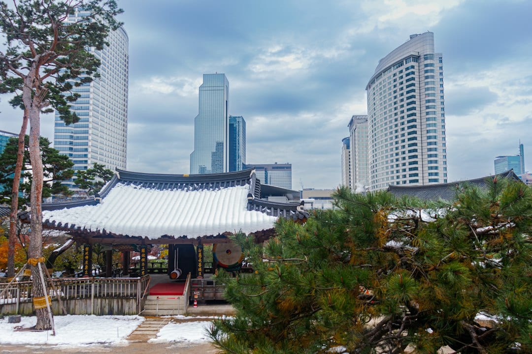 Bongeunsa Temple with modern Seoul skyscrapers in the background