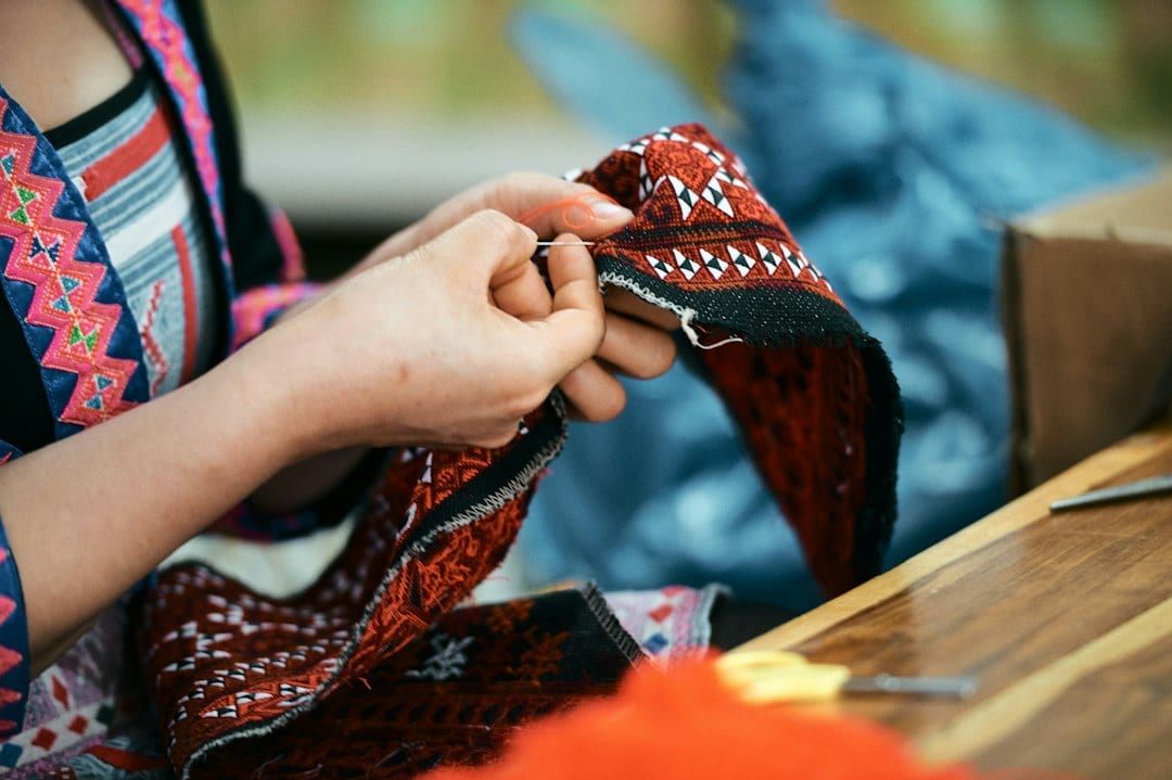Karen hill tribe woman weaving traditional textiles in Chiang Mai