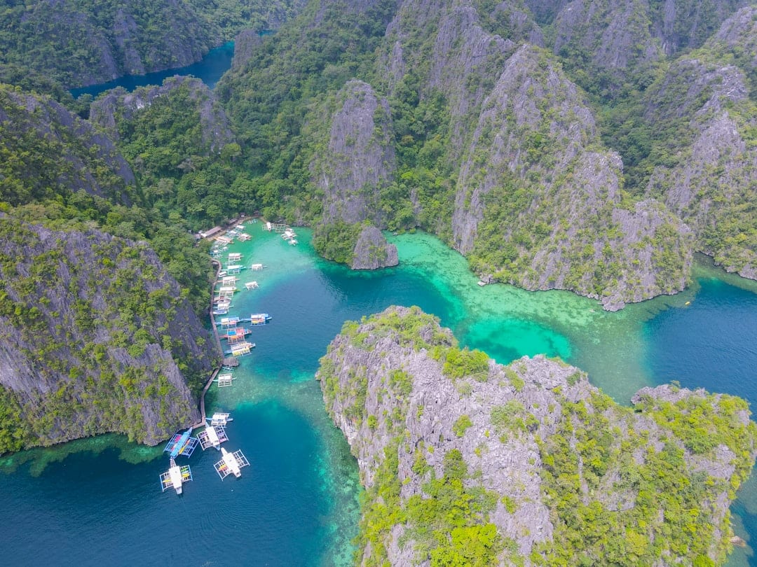 El Nido island hopping tour with dramatic limestone cliffs and hidden turquoise lagoon