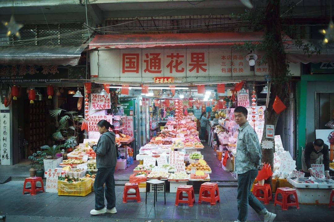 Locals shopping at a bustling Guangzhou wet market in the early morning
