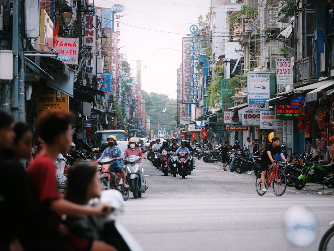 Motorbikes flowing through a busy intersection in Ho Chi Minh City District 1