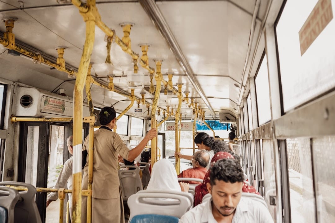 Interior of Indian train AC sleeper class with passengers seated