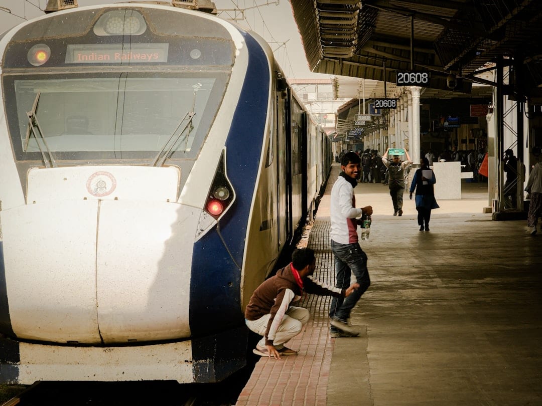 Busy Indian train platform with passengers boarding