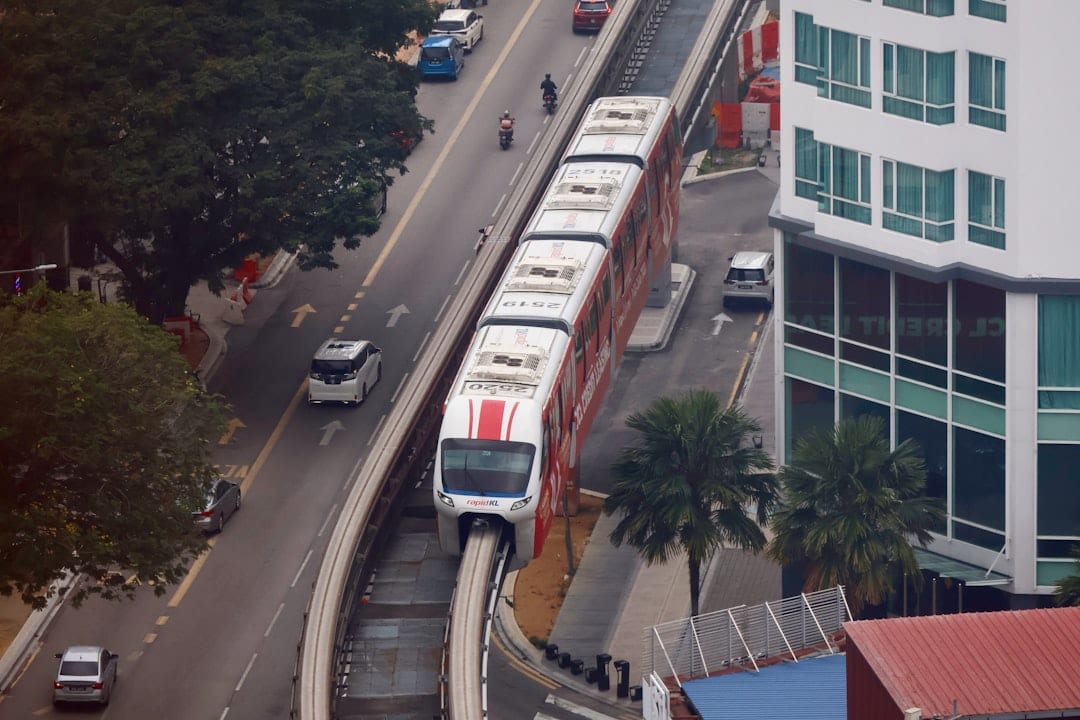 Monorail train on elevated track in an urban environment