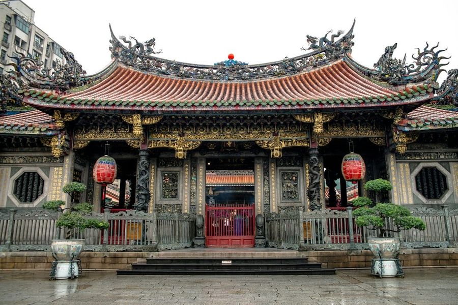Longshan Temple in Taipei with intricate roof carvings