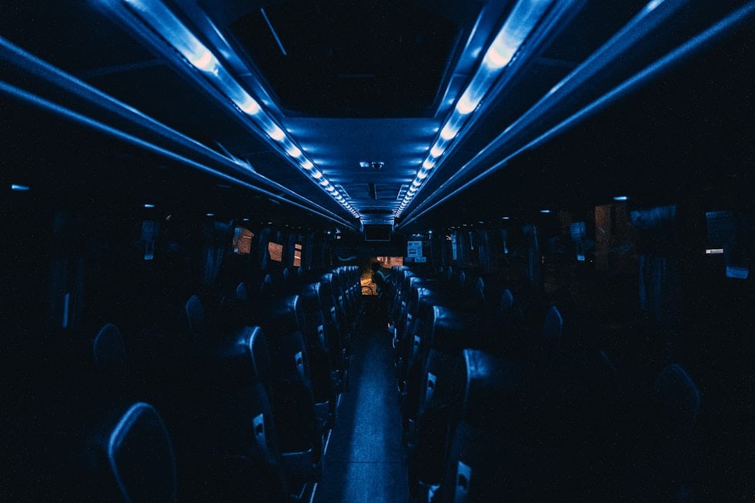 Modern coach bus interior with comfortable reclining seats