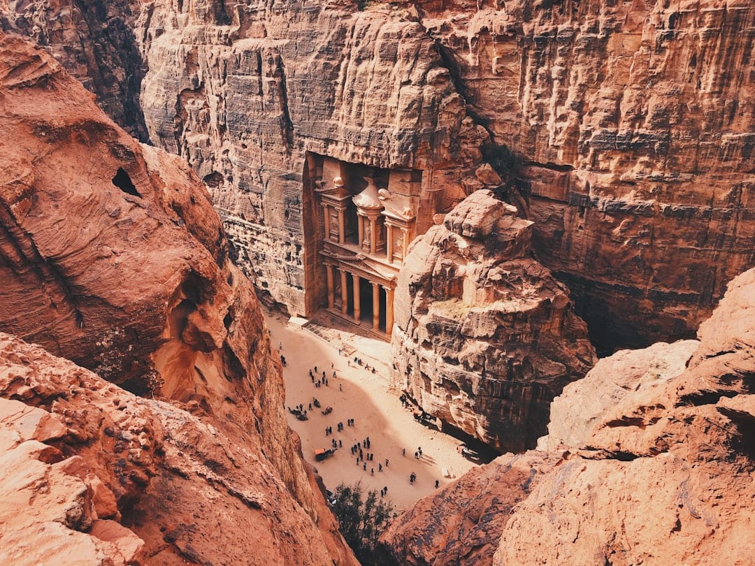 The Treasury carved into sandstone cliffs in Petra, Jordan