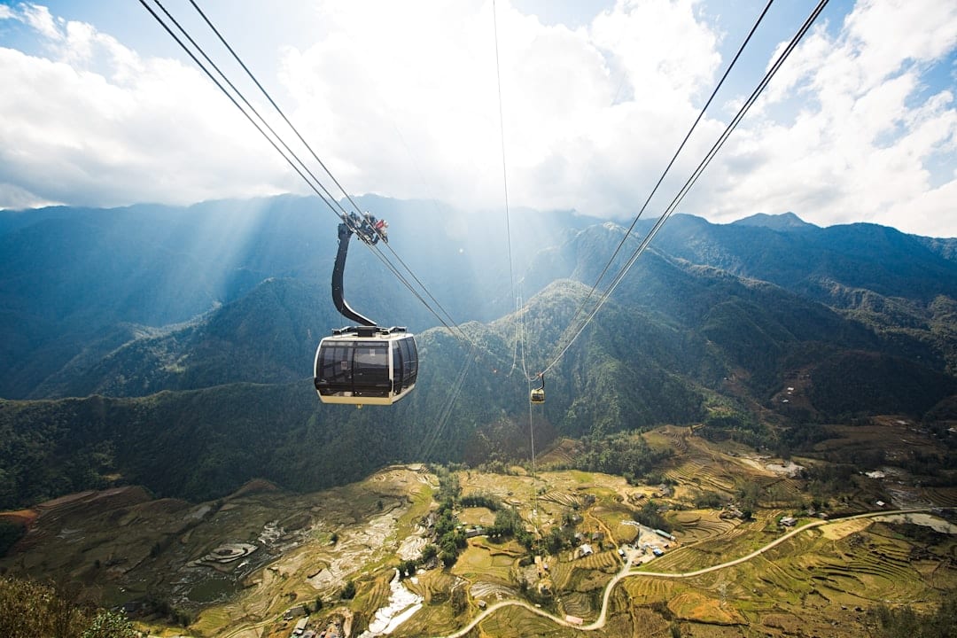 Fansipan cable car ascending above Sapa mountain valleys