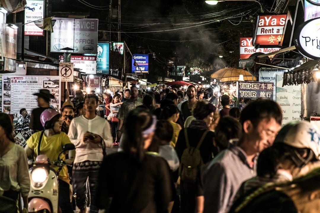 Colorful night market stalls with lanterns and street food in Thailand