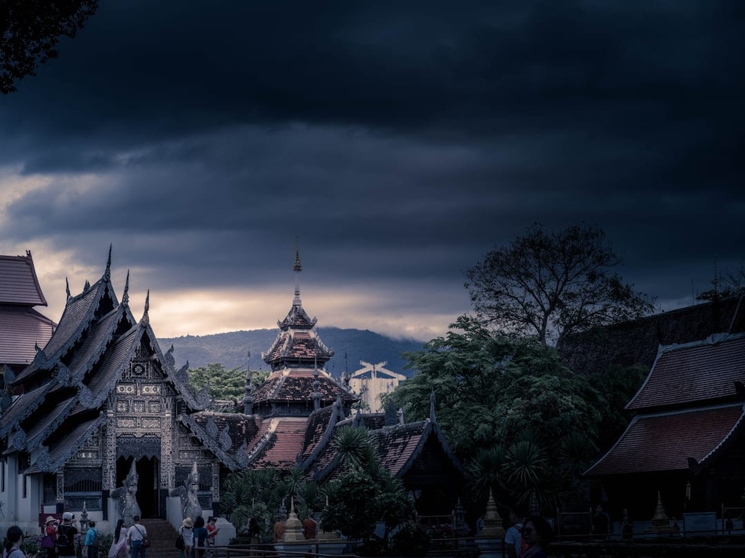 The golden chedi of Wat Phra That Doi Suthep temple gleaming at sunset above Chiang Mai